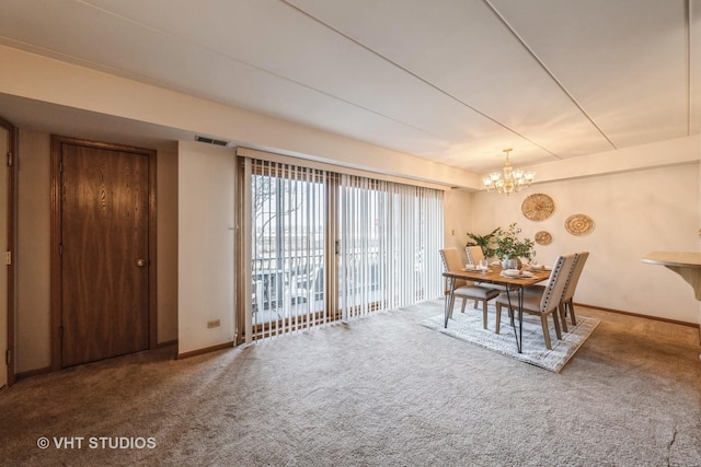 dining room featuring baseboards, visible vents, a chandelier, and carpet flooring