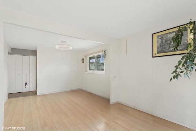 spare room featuring light hardwood / wood-style flooring