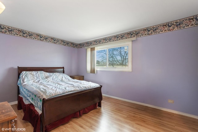 bedroom with light wood-type flooring