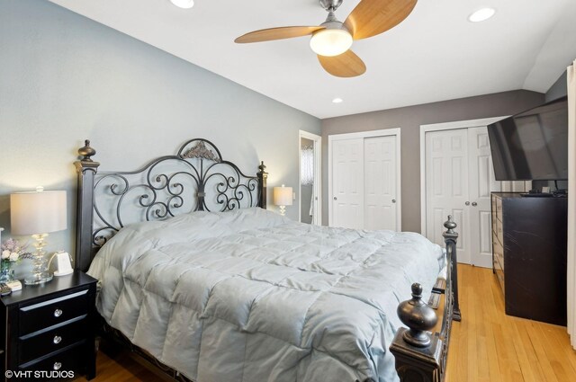 bedroom featuring multiple closets, recessed lighting, ceiling fan, and wood finished floors