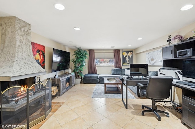 office with light tile patterned floors, a premium fireplace, and recessed lighting