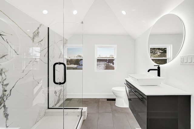 full bath featuring lofted ceiling, toilet, vanity, and a marble finish shower