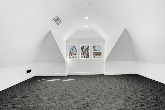 bonus room featuring recessed lighting, visible vents, dark carpet, vaulted ceiling, and baseboards