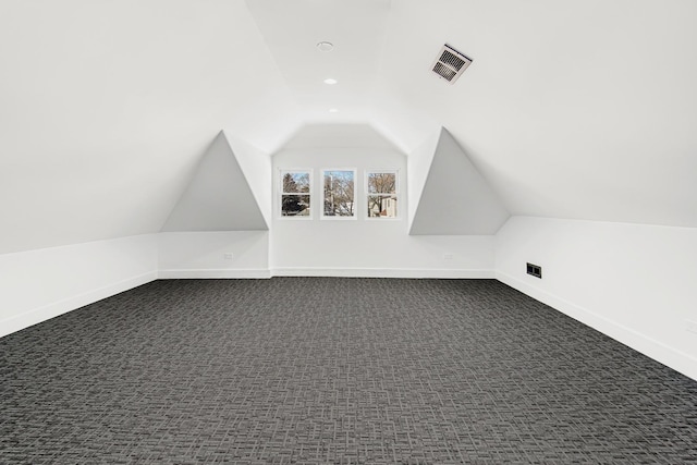 bonus room with visible vents, baseboards, lofted ceiling, dark carpet, and recessed lighting