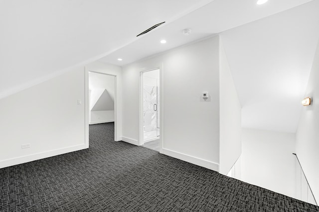 bonus room featuring dark colored carpet, baseboards, and recessed lighting