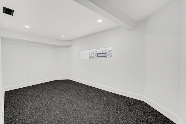 empty room featuring baseboards, beamed ceiling, visible vents, and recessed lighting