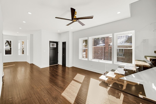 living area with a ceiling fan, recessed lighting, dark wood finished floors, and baseboards