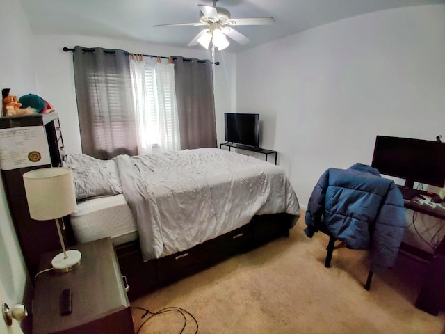 bedroom with light colored carpet and ceiling fan