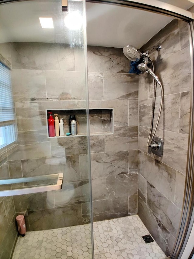 full bath with a shower stall