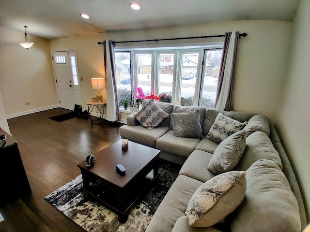 living room featuring recessed lighting, baseboards, and wood finished floors