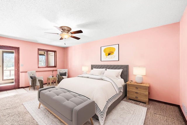 bedroom featuring baseboards, light carpet, a textured ceiling, a ceiling fan, and access to outside