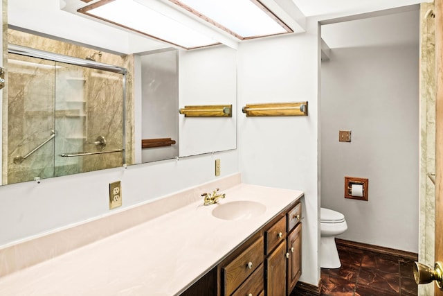 bathroom with an enclosed shower, toilet, vanity, and baseboards