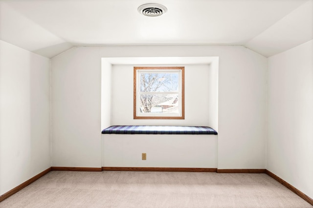 bonus room featuring visible vents, lofted ceiling, light colored carpet, and baseboards