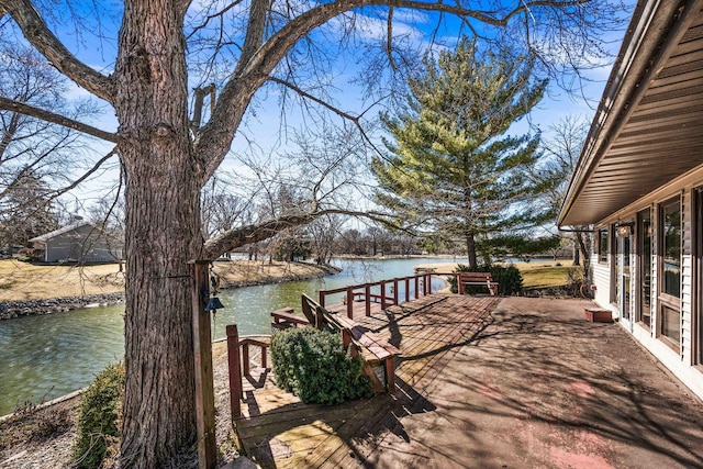 wooden deck featuring a water view