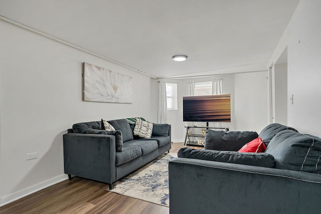 living room with wood finished floors and baseboards