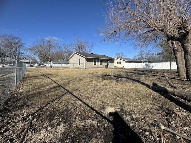 view of side of property featuring fence