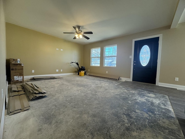 foyer with baseboards, baseboard heating, and a ceiling fan