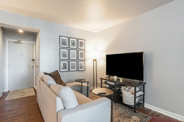 living room featuring dark wood finished floors and baseboards