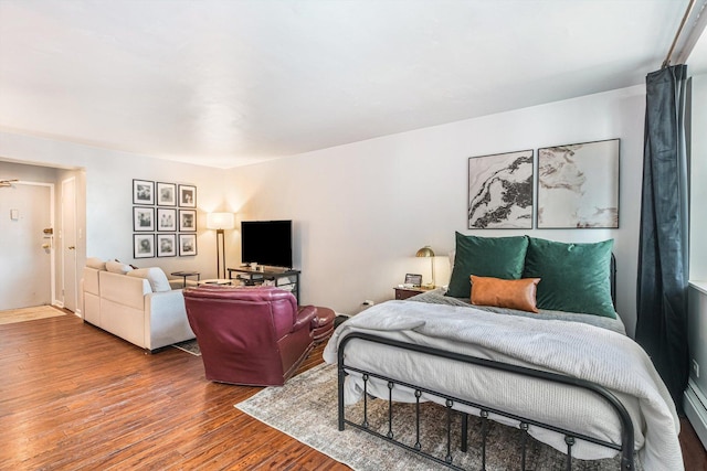 bedroom featuring wood finished floors