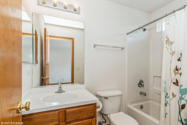 bathroom with vanity, toilet, and shower / bath combo with shower curtain