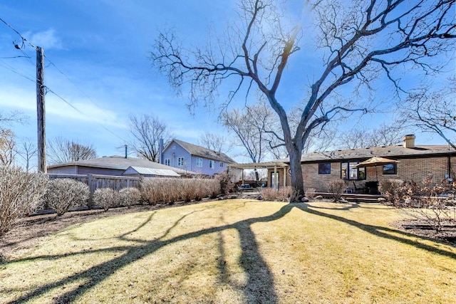 view of yard with fence