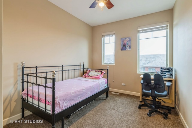 bedroom with ceiling fan, carpet, and baseboards