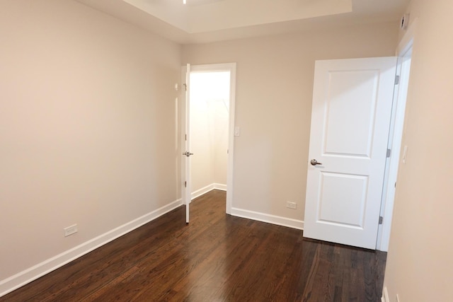 unfurnished bedroom with dark hardwood / wood-style floors