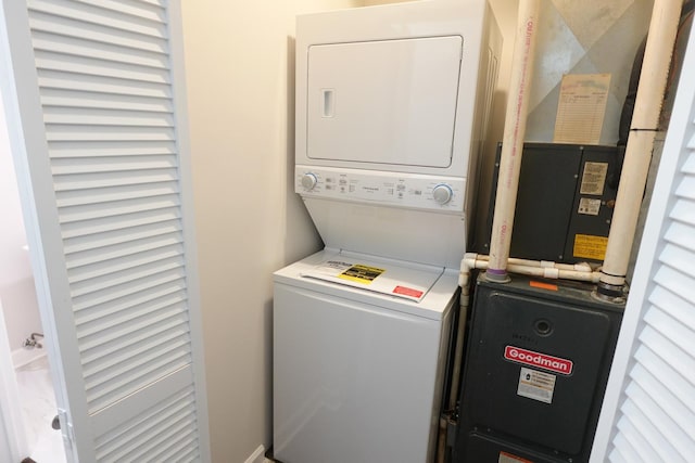 laundry room featuring stacked washer / dryer