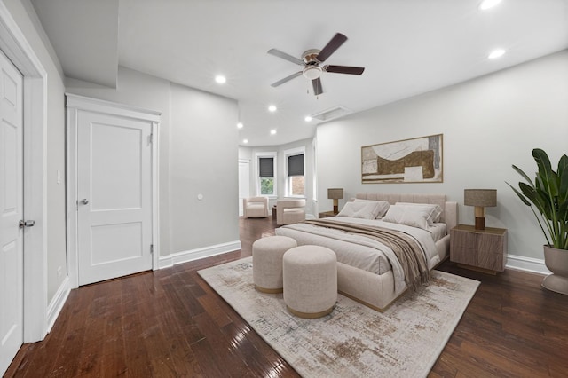 bedroom with dark hardwood / wood-style floors and ceiling fan