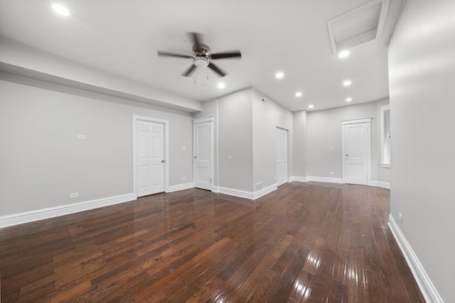 spare room featuring ceiling fan and dark hardwood / wood-style floors