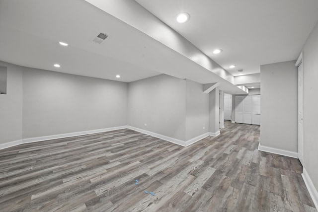 basement featuring hardwood / wood-style flooring