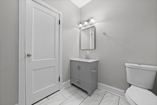 bathroom with toilet and vanity