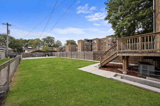 view of yard with a wooden deck