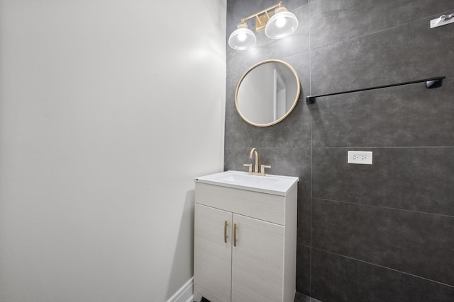 bathroom with tile walls and vanity