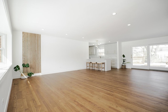 unfurnished living room with light hardwood / wood-style flooring