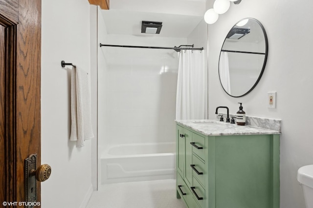 full bath featuring toilet, shower / tub combo with curtain, and vanity