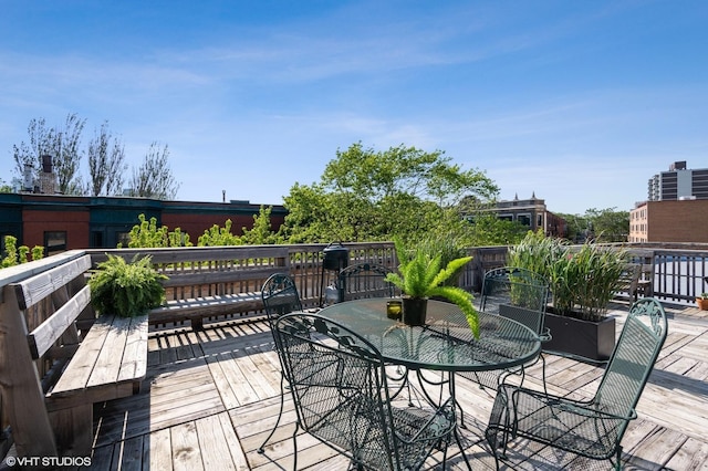 deck featuring outdoor dining area