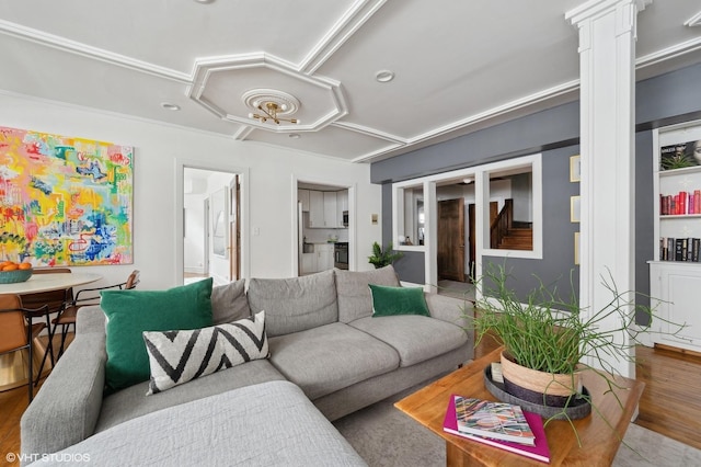 living area with ornate columns and wood finished floors