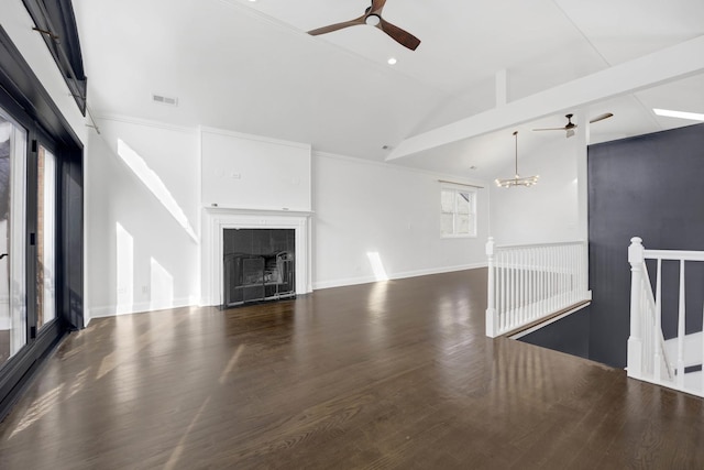 unfurnished living room with a fireplace, dark wood-type flooring, ceiling fan with notable chandelier, and lofted ceiling