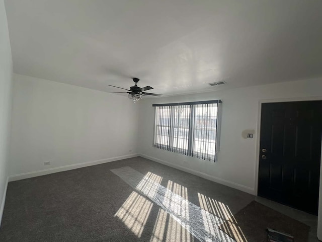 interior space with ceiling fan