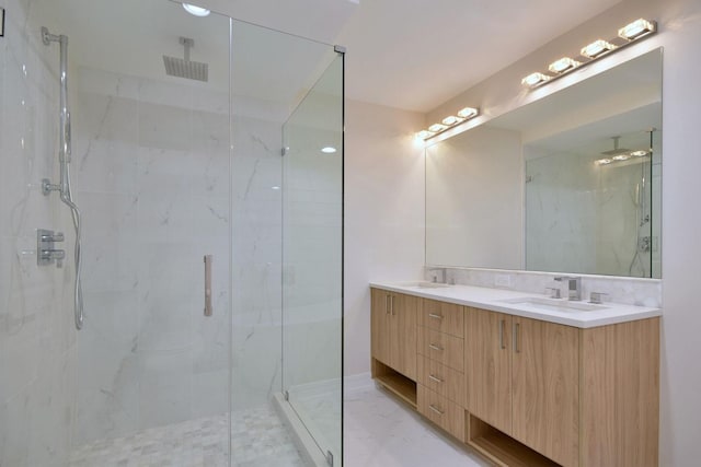 bathroom featuring a sink, marble finish floor, backsplash, a marble finish shower, and double vanity