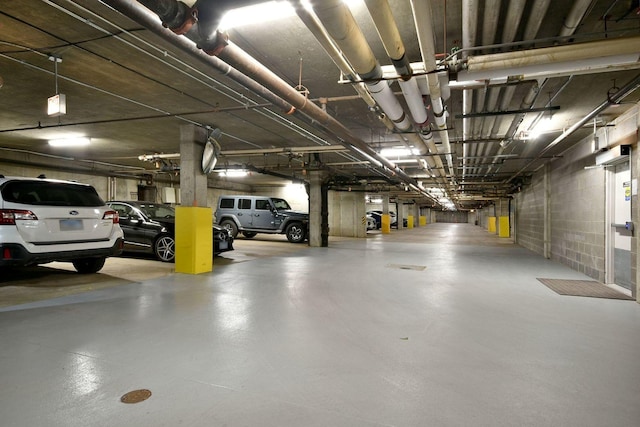 parking garage featuring concrete block wall