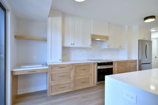 kitchen featuring light brown cabinets, stainless steel appliances, light wood-type flooring, backsplash, and open shelves