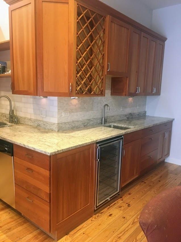 kitchen featuring stainless steel dishwasher, wine cooler, light wood finished floors, and a sink