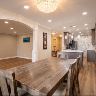 dining room featuring recessed lighting, arched walkways, crown molding, and wood finished floors