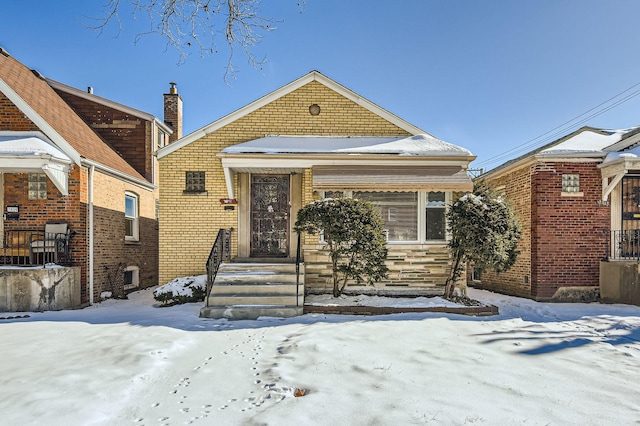 view of front of house with brick siding