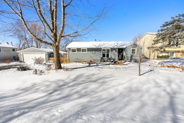 view of front of property with an outdoor structure and a garage