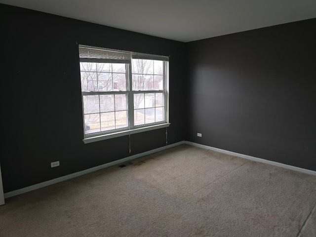 view of carpeted spare room