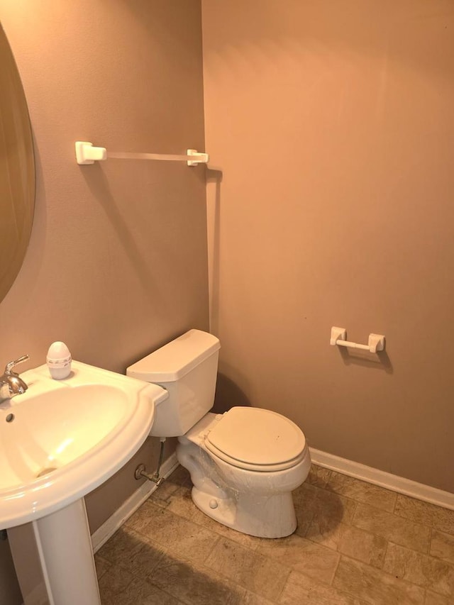 bathroom featuring sink and toilet