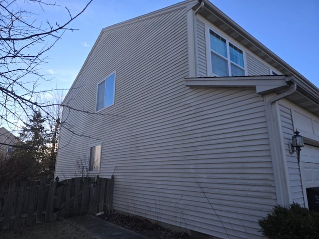 view of property exterior with a garage